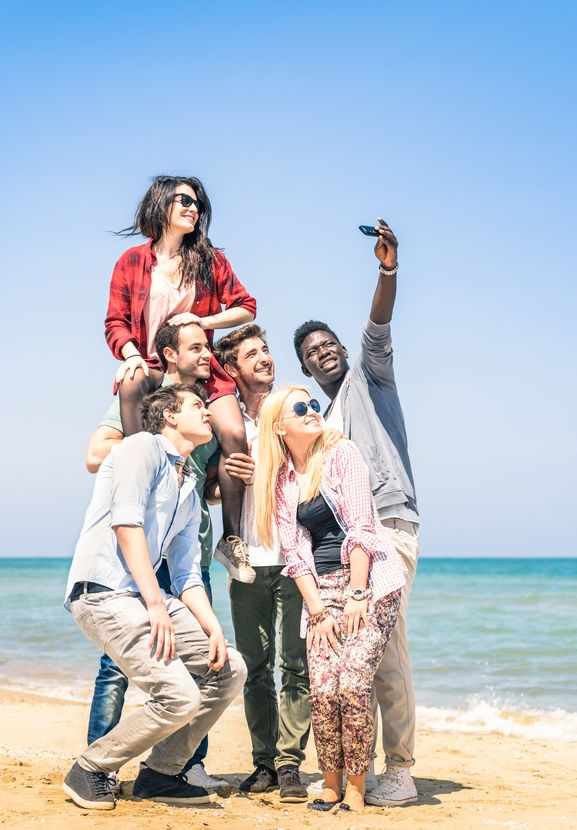 Group taking selfie for social media